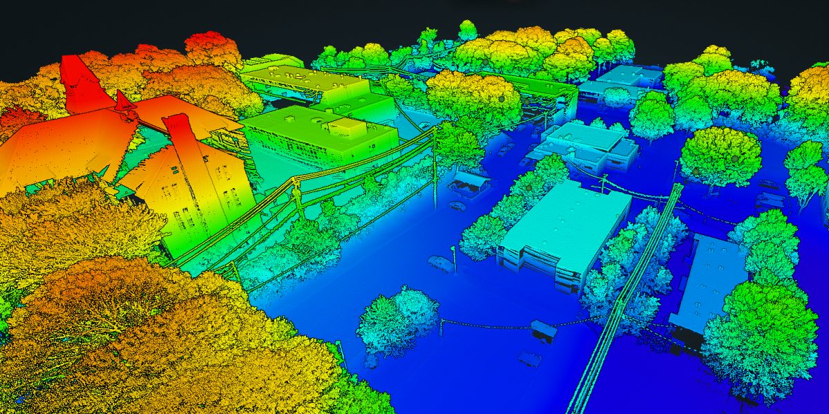 Height colored 3D survey map produced from FX-1 flight data: buildings, trees, roads, and vehicles resolved in a LiDAR style point cloud